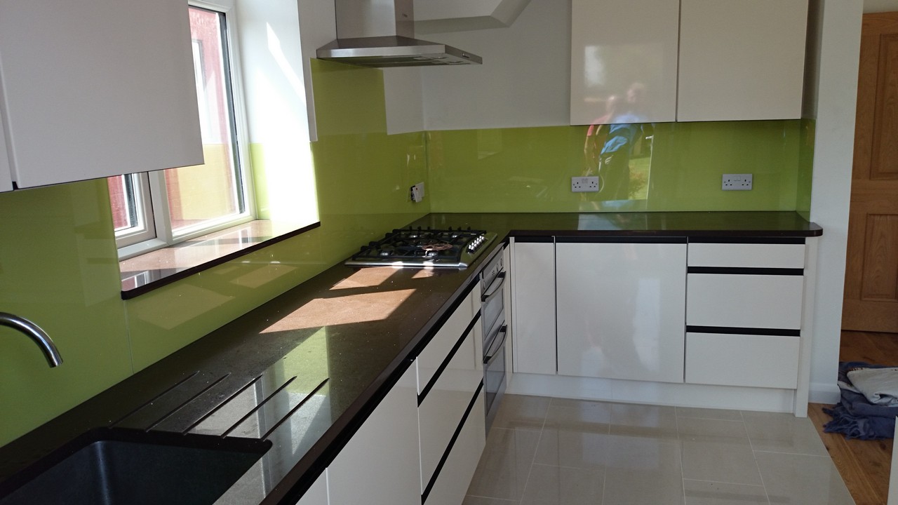 Lime green glass kitchen splashback installed by Bletchley glaziers
